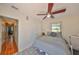 Comfortable bedroom with a ceiling fan and a view of the outdoors, offering a relaxing and peaceful atmosphere at 4509 10Th N Ave, St Petersburg, FL 33713