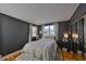 Cozy bedroom with dark walls, hardwood floors, and ample natural light, creating a serene and inviting atmosphere at 4509 10Th N Ave, St Petersburg, FL 33713