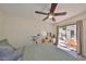 Comfortable bedroom with a ceiling fan and sliding glass door to the patio, offering a relaxing and seamless indoor-outdoor transition at 4509 10Th N Ave, St Petersburg, FL 33713