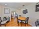 Charming dining room with hardwood floors, an arched doorway, and views of the living area at 4509 10Th N Ave, St Petersburg, FL 33713
