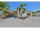 Charming home featuring a stucco exterior, carport, arched porch and a lovely, landscaped yard at 4509 10Th N Ave, St Petersburg, FL 33713