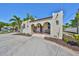 Charming stucco home showcasing an arched porch and mature landscaping at 4509 10Th N Ave, St Petersburg, FL 33713