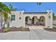 Charming stucco home featuring an arched porch and decorative details for a unique curb appeal at 4509 10Th N Ave, St Petersburg, FL 33713