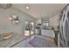 Renovated kitchen showcasing white cabinets, stainless steel appliances, and easy access to the patio at 4509 10Th N Ave, St Petersburg, FL 33713