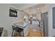 Modern kitchen with white cabinets, stainless steel appliances, a breakfast bar, and outdoor patio access at 4509 10Th N Ave, St Petersburg, FL 33713