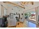Stunning living room featuring vaulted ceilings, exposed beams, and a cozy fireplace at 4509 10Th N Ave, St Petersburg, FL 33713