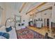 Bright living room with vaulted ceilings, exposed beams, hardwood floors, and elegant chandelier at 4509 10Th N Ave, St Petersburg, FL 33713