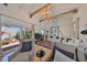 Bright living room featuring exposed beams, hardwood floors, chandelier, and a private outdoor patio at 4509 10Th N Ave, St Petersburg, FL 33713