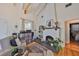 Living area features hardwood floors, a painted brick fireplace and custom shelving at 4509 10Th N Ave, St Petersburg, FL 33713