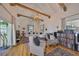 Spacious living room with vaulted ceiling, exposed beams, hardwood floors and ample natural light at 4509 10Th N Ave, St Petersburg, FL 33713
