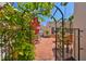 Picturesque patio entrance, framed by an arched trellis, leads to a cozy outdoor seating area at 4509 10Th N Ave, St Petersburg, FL 33713