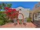 Cozy outdoor seating area with colorful flowers and artistic archway in a private courtyard at 4509 10Th N Ave, St Petersburg, FL 33713