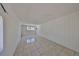 Bright room featuring tiled floor, white paneled walls and several windows at 4509 10Th N Ave, St Petersburg, FL 33713