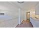 Bright room with tile floor transitions to brick near a sink, with a bathroom nearby at 4509 10Th N Ave, St Petersburg, FL 33713
