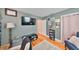 Cozy room with hardwood floors, neutral paint, and a mounted television, creating a comfortable and functional living area at 4509 10Th N Ave, St Petersburg, FL 33713