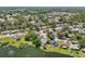 Aerial view of a charming neighborhood nestled by a picturesque lake and lush greenery at 505 Timber Pond Dr, Brandon, FL 33510
