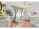 Cozy Bedroom with wood-look floors, accent chairs, and natural light creating a serene atmosphere at 505 Timber Pond Dr, Brandon, FL 33510