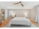 Relaxing bedroom featuring a plush bed, ceiling fan, and an ensuite bathroom for added convenience at 505 Timber Pond Dr, Brandon, FL 33510