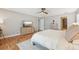 Inviting bedroom showcasing wood floors, media center and a ceiling fan for optimal comfort and style at 505 Timber Pond Dr, Brandon, FL 33510