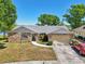 Single-story home boasts a beautiful stone facade, attached garage, and lovely landscaping at 505 Timber Pond Dr, Brandon, FL 33510