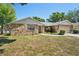 Charming single-story home with stone accents, attached garage, and a manicured front lawn at 505 Timber Pond Dr, Brandon, FL 33510