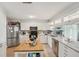 Spacious kitchen with modern stainless steel appliances, granite countertops, and a functional island at 505 Timber Pond Dr, Brandon, FL 33510