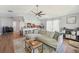 Living space with view into kitchen, featuring plank floors and a comfortable sectional sofa at 505 Timber Pond Dr, Brandon, FL 33510