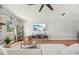 Bright living room with wood floors, neutral walls, a large window, and a modern entertainment center at 505 Timber Pond Dr, Brandon, FL 33510