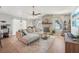Spacious living room showcasing a stone fireplace, lots of light, and a comfortable sectional sofa at 505 Timber Pond Dr, Brandon, FL 33510