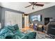 Stylish living room featuring a comfortable couch, a wall-mounted TV, and ample space for relaxing and entertaining at 505 Timber Pond Dr, Brandon, FL 33510