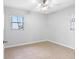 Bright bedroom with ceiling fan, tile floors, and a window at 5103 Town N Country Blvd, Tampa, FL 33615