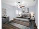 Comfortable bedroom with stylish decor, including a cozy bed, ceiling fan, and complementary furnishings at 5103 Town N Country Blvd, Tampa, FL 33615