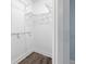 Walk-in closet featuring laminate floors and wire shelving at 5103 Town N Country Blvd, Tampa, FL 33615