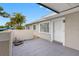 Exterior showing a covered porch, front door and neutral stucco at 5103 Town N Country Blvd, Tampa, FL 33615