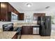 Stylish kitchen features granite counters, stainless steel appliances, and ample counter space at 5103 Town N Country Blvd, Tampa, FL 33615