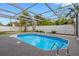 Sparkling pool featuring pool enclosure, newer deck, and a backyard shed at 5103 Town N Country Blvd, Tampa, FL 33615