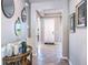 Inviting entryway with elegant decor, neutral colors, and durable tile flooring at 5309 Oxford Gray Rd, Wesley Chapel, FL 33545