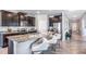Modern kitchen with granite countertops, stainless steel appliances, and a breakfast bar at 5309 Oxford Gray Rd, Wesley Chapel, FL 33545