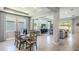 Open-concept living space featuring a dining area and living room with lots of light at 5309 Oxford Gray Rd, Wesley Chapel, FL 33545