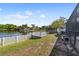 Spacious backyard featuring a deck, lake access, and room for outdoor activities and entertainment at 8024 Timberlane Dr, Tampa, FL 33615