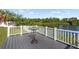 Beautiful backyard deck overlooking a serene lake view, ideal for outdoor enjoyment at 8024 Timberlane Dr, Tampa, FL 33615