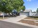 Charming single-Gathering home with a well-maintained lawn and a two-car garage at 8024 Timberlane Dr, Tampa, FL 33615