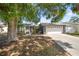 Inviting single-story home with a two-car garage, lush landscaping, and curb appeal at 8024 Timberlane Dr, Tampa, FL 33615