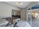 Recreation room with foosball table and sliding glass door to an outdoor dining area at 8024 Timberlane Dr, Tampa, FL 33615