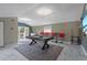 Open game room with a pool table and bar area, perfect for entertaining guests at 8024 Timberlane Dr, Tampa, FL 33615