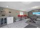 Entertainment room boasts a billiard table, bar area and modern marble floors at 8024 Timberlane Dr, Tampa, FL 33615