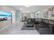 Open-concept living room with stylish decor and access to other areas of the home at 8024 Timberlane Dr, Tampa, FL 33615