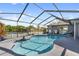 Gorgeous screened-in pool area with a view of the lake at 8024 Timberlane Dr, Tampa, FL 33615