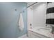 Bathroom featuring white tile, a vanity, shower with curtain and modern fixtures at 8122 Ehren Cemetery Rd, Land O Lakes, FL 34639