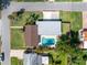 Aerial view of property showcasing the layout, including the pool, landscaping, and proximity to nearby amenities at 1101 39Th Ne Ave, St Petersburg, FL 33703